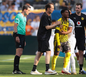 New Jersey, USA, 5th July 2025. Fran Garcia of Real Madrid embraces Julien Duranville of Borussia Dortmund as he leaves the field of play with medical staff after picking up an injury in a clash with the Spanish full back during the Real Madrid vs Borussia Dortmund FIFA Club World Cup match at Metlife Stadium, New Jersey. Picture credit should read: Jonathan Moscrop / Sportimage EDITORIAL USE ONLY. No use with unauthorised audio, video, data, fixture lists, club/league logos or live services. Online in-match use limited to 120 images, no video emulation. No use in betting, games or single club/league/player publications. SPI_101_JM_REALMADRID_BORUSSIA_ SPI-4005-0101