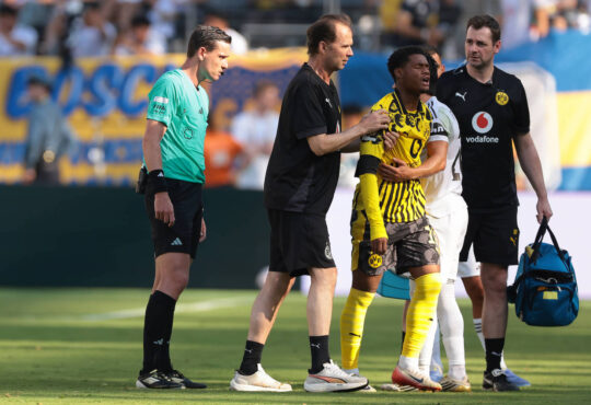 New Jersey, USA, 5th July 2025. Fran Garcia of Real Madrid embraces Julien Duranville of Borussia Dortmund as he leaves the field of play with medical staff after picking up an injury in a clash with the Spanish full back during the Real Madrid vs Borussia Dortmund FIFA Club World Cup match at Metlife Stadium, New Jersey. Picture credit should read: Jonathan Moscrop / Sportimage EDITORIAL USE ONLY. No use with unauthorised audio, video, data, fixture lists, club/league logos or live services. Online in-match use limited to 120 images, no video emulation. No use in betting, games or single club/league/player publications. SPI_101_JM_REALMADRID_BORUSSIA_ SPI-4005-0101